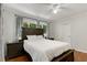 Main bedroom offers a serene retreat with hardwood floors, large windows and a closet that brings in natural light at 553 Collingwood Dr, Decatur, GA 30032