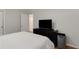 A modern bedroom features a large television, hardwood flooring and neutral walls at 553 Collingwood Dr, Decatur, GA 30032