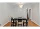 Dining room with hardwood floors, a chandelier, and seating for four at 553 Collingwood Dr, Decatur, GA 30032