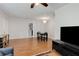 Open-concept dining area featuring hardwood floors and easy access to kitchen at 553 Collingwood Dr, Decatur, GA 30032