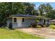 Charming single-story home with well-maintained landscaping and inviting front entrance at 553 Collingwood Dr, Decatur, GA 30032