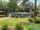 Charming single-story home featuring a well-maintained front yard and inviting curb appeal at 553 Collingwood Dr, Decatur, GA 30032