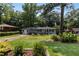 Charming single-story home with a well-manicured lawn and mature trees at 553 Collingwood Dr, Decatur, GA 30032