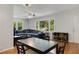 Well lit living space features a dining area, hardwood floors, and comfortable seating at 553 Collingwood Dr, Decatur, GA 30032