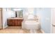 Bright bathroom features a double sink vanity, soaking tub and walk-in shower at 100 Marshas Vineyard, Hampton, GA 30228