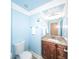 Well-lit bathroom with granite counters, wood cabinets, and modern fixtures at 100 Marshas Vineyard, Hampton, GA 30228