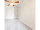 Bright bedroom features neutral walls, plush carpet, and a modern ceiling fan at 100 Marshas Vineyard, Hampton, GA 30228