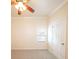 Bedroom with ceiling fan, carpeted floors, window, and white trim at 100 Marshas Vineyard, Hampton, GA 30228