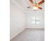 Bedroom with a window bringing in natural light, neutral walls, and plush carpet at 100 Marshas Vineyard, Hampton, GA 30228