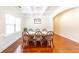 Formal dining room featuring hardwood floors, stylish chairs, and a bright window at 100 Marshas Vineyard, Hampton, GA 30228