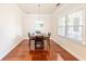 Dining room with hardwood floors, crown molding, and plenty of natural light at 100 Marshas Vineyard, Hampton, GA 30228