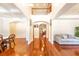 Bright foyer featuring hardwood floors, arched doorways, and a view of the second-floor balcony at 100 Marshas Vineyard, Hampton, GA 30228