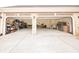 Large, well-lit three-car garage with ample space for vehicles and storage at 100 Marshas Vineyard, Hampton, GA 30228