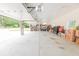 Spacious garage featuring high ceilings, abundant storage, and natural light; perfect for hobbyists or car enthusiasts at 100 Marshas Vineyard, Hampton, GA 30228