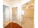 Hallway featuring multiple doorways and hardwood flooring at 100 Marshas Vineyard, Hampton, GA 30228