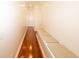 Hallway featuring hardwood floors and a cushioned bench seat at 100 Marshas Vineyard, Hampton, GA 30228