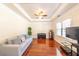 Cozy living room featuring hardwood floors, neutral walls, and natural light at 100 Marshas Vineyard, Hampton, GA 30228