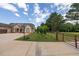 Well-maintained side yard with a basketball hoop, fenced perimeter, and lush greenery, providing privacy and space for recreation at 100 Marshas Vineyard, Hampton, GA 30228