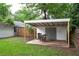 Backyard view with covered shed, patio, and lawn at 3116 Jackson St, Hapeville, GA 30354