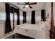 Comfortable bedroom with ceiling fan, multiple windows, and unique decor at 3116 Jackson St, Hapeville, GA 30354