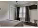 Bedroom with TV, large windows, and neutral decor at 3116 Jackson St, Hapeville, GA 30354