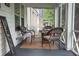 Relaxing screened porch featuring wicker furniture and a cozy atmosphere at 3116 Jackson St, Hapeville, GA 30354