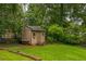 Backyard showing a wooden shed with space for storage at 3553 Lakeview Dr, Rex, GA 30273