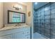 Updated bathroom with a sleek shower and a modern vanity with marble countertop at 3553 Lakeview Dr, Rex, GA 30273