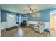 Cozy living room with hardwood floors, comfortable seating, and ample natural light at 3553 Lakeview Dr, Rex, GA 30273