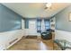 Comfortable living room featuring hardwood floors and a cozy recliner chair at 3553 Lakeview Dr, Rex, GA 30273
