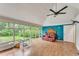 Bright sunroom with lots of windows overlooking the backyard and vinyl flooring at 3553 Lakeview Dr, Rex, GA 30273