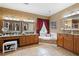 Bathroom includes double vanities, soaking tub, framed mirrors and neutral color scheme at 7131 Ridge Rd, Hiram, GA 30141