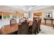 Elegant dining room with coffered ceilings, chandelier, and seamless access to the kitchen at 7131 Ridge Rd, Hiram, GA 30141