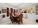 Elegant dining room with a large table, chandelier, and seamless access to the living room at 7131 Ridge Rd, Hiram, GA 30141