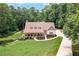 Beautiful two-story home with a covered porch and an expansive manicured lawn at 7131 Ridge Rd, Hiram, GA 30141