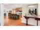 Open-concept kitchen featuring a breakfast bar, wood cabinets, granite countertops, and stainless steel appliances at 7131 Ridge Rd, Hiram, GA 30141