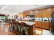 Kitchen with granite countertops, wood cabinets, stainless steel appliances, and a breakfast bar at 7131 Ridge Rd, Hiram, GA 30141