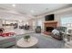 Open basement living area featuring fireplace, living and dining spaces and natural light at 7131 Ridge Rd, Hiram, GA 30141