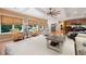 Bright living room with a large window, comfortable seating, and a decorative ceiling fan at 7131 Ridge Rd, Hiram, GA 30141