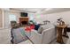 Basement living room area featuring a brick fireplace, TV, and comfortable seating at 7131 Ridge Rd, Hiram, GA 30141