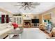 Spacious living room with a fireplace, coffered ceiling, and large windows at 7131 Ridge Rd, Hiram, GA 30141