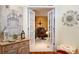View of home office through white double doors; includes wood floors, desk, and upholstered chair at 7131 Ridge Rd, Hiram, GA 30141