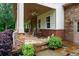 Inviting front porch with stone accents, ample seating, and a cozy atmosphere at 7131 Ridge Rd, Hiram, GA 30141