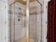 Shower stall featuring glass enclosure, tiled walls, and modern fixtures at 7131 Ridge Rd, Hiram, GA 30141