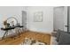 Bedroom featuring hardwood floors and a desk with a stylish chair at 1129 Victory Sw Dr, Atlanta, GA 30310