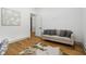 Charming bedroom features hardwood floors, and a neutral-colored sofa at 1129 Victory Sw Dr, Atlanta, GA 30310