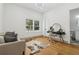Well-lit bedroom features hardwood floors and an animal print rug at 1129 Victory Sw Dr, Atlanta, GA 30310