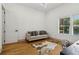 Well-lit bedroom featuring hardwood floors and an animal print rug at 1129 Victory Sw Dr, Atlanta, GA 30310