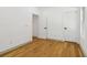 Bedroom boasting hardwood floors, white doors, and neutral wall colors at 1129 Victory Sw Dr, Atlanta, GA 30310