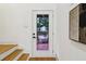 Entryway with hardwood floors and staircase featuring white trim at 1129 Victory Sw Dr, Atlanta, GA 30310